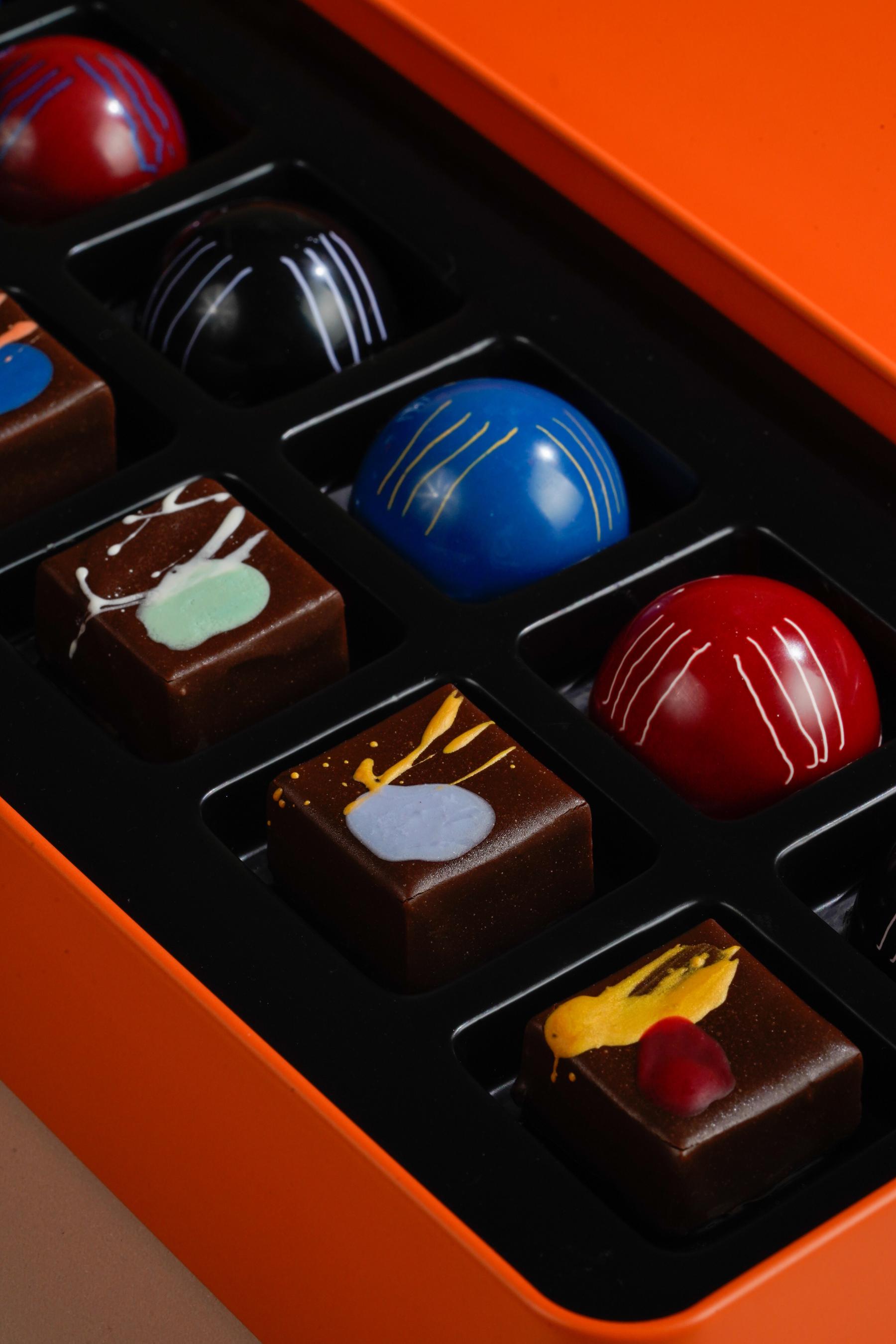 Inside the box of KAKAW Signature Assorted Chocolate Box in collaboration with Sejauh Mata Memandang from Jakarta’s chocolate shop at Ashta District 8